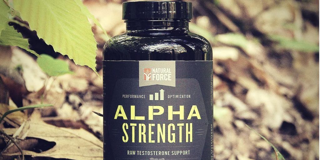 A bottle of alpha strength sits on the ground.