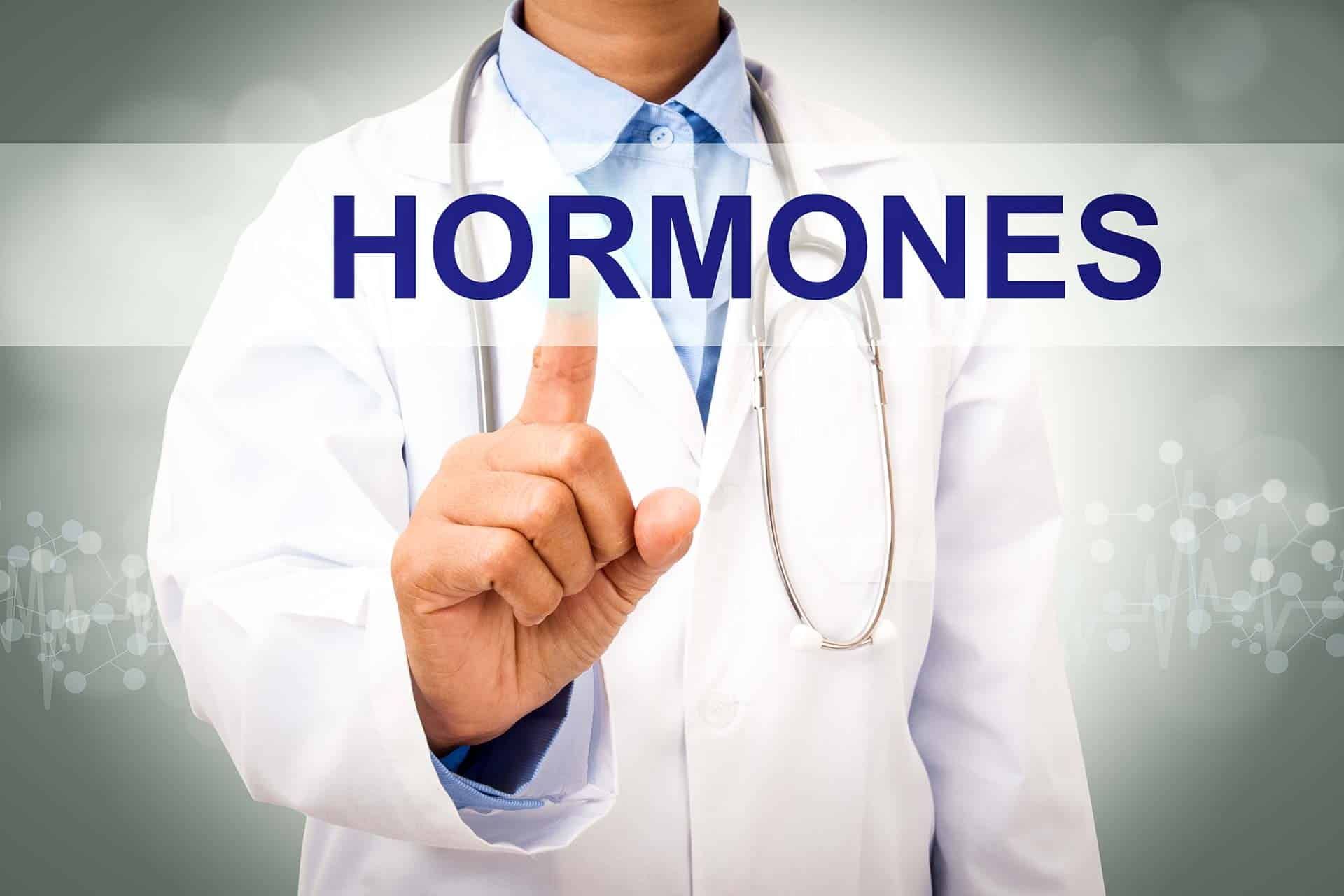 Hormone Health Test a doctor with a sign on his hand