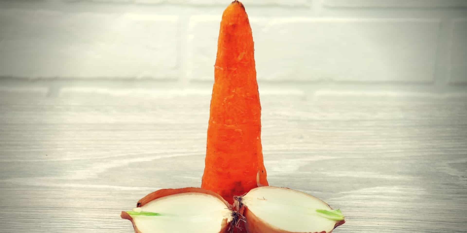 Foods for Erection Carrots with onions on a wooden gray table